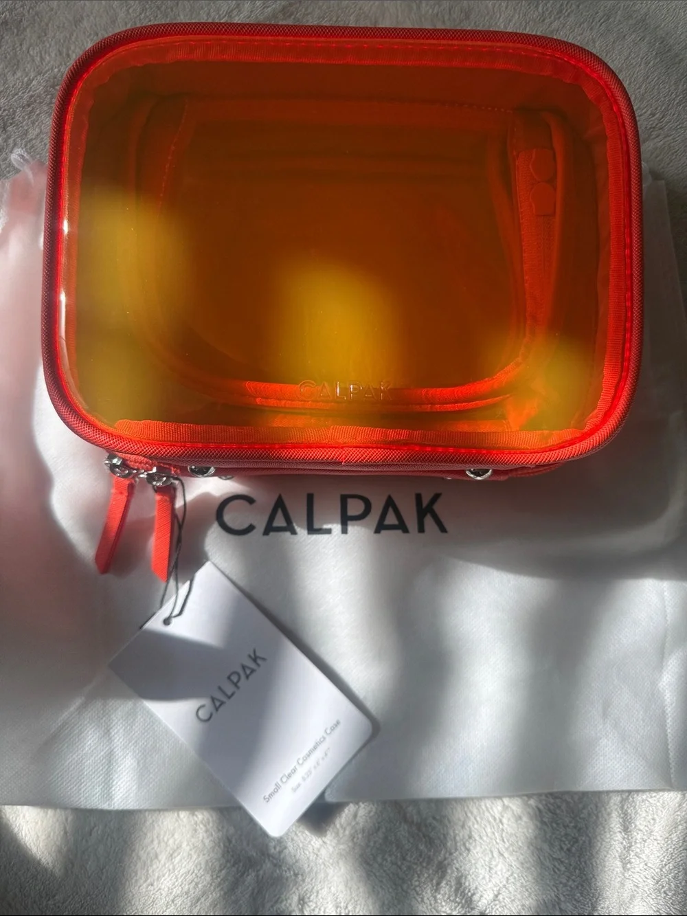 Calpak Small Clear Cosmetic Case in Papaya Limited Edition
